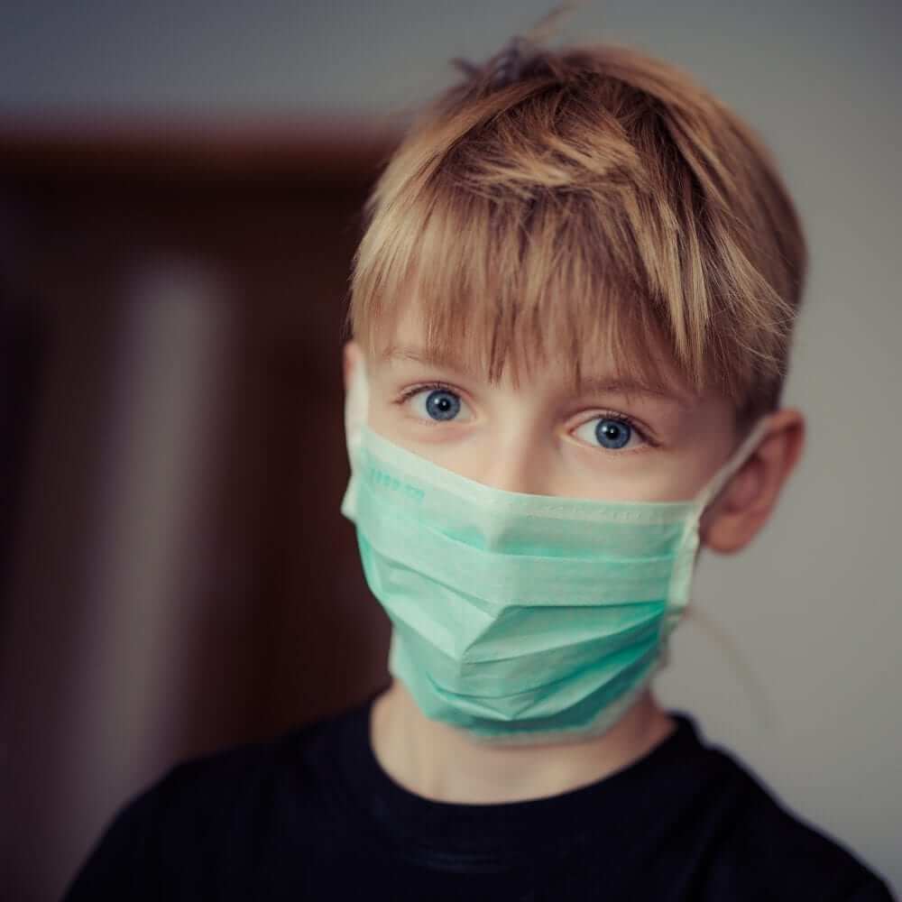 Boy wearing surgical mask